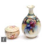 A small early 20th Century Royal Worcester bud vase decorated with hand painted violets with moulded