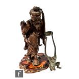 A late 19th Century bronzed figure of an ape holding a bowl above is head, height 28cm, and a