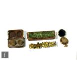 A 19th Century cased set of brass sovereign scales by Simmons, improved patent, a single brass fob