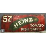 An early 20th Century enamel advertising sign '57, Heinz Tomato Fish Sauce', white lettering on a