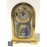 A contemporary Crummles English enamels miniature brass clock of arched form, the enamelled front