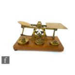 A set of late 19th to early 20th Century S. Mordan & Co brass postage scales with twelve brass