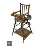An early 20th Century beech wood child's high chair, together with small enamelled chamber pot, S/D.