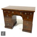 A 19th Century mahogany kneehole pedestal desk, fitted with three frieze drawers and three further
