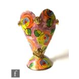 A Mary Rose Young studio pottery vase of heart form raised on a domed foot, hand painted with