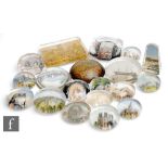 A collection of late 19th and early 20th Century souvenir paperweights in clear crystal with reverse