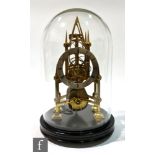 A 19th Century Gothic Revival brass skeleton clock of architectural form, with a 4.5 inch silvered
