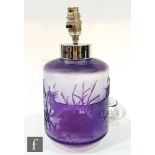 A later 20th Century cased cameo glass lamp, decorated with ducks in a pond landscape in amethyst,