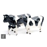 Three Beswick cattle comprising Friesian Cow Ch. Claybury Leegwater model 1362A, Friesian Bull Ch.