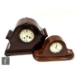 An Edwardian mahogany cased mantle clock, serpentine shaped case and a similar smaller mantle clock,