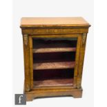 A Louis XV style inlaid and gilt mounted walnut pier cabinet, the shelf interior enclosed by a