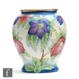 A Moorcroft Enamel vase decorated with hand painted flowers, printed mark, boxed, height 7.5cm.