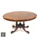 A Victorian inlaid and figured walnut oval breakfast table, on four turned pillar supports, scroll