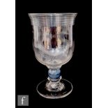 A large late 18th to early 19th Century coin goblet, the bowl with a flared rim with applied self
