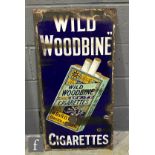 An early 20th Century enamel advertising sign for W.D. & H.O. Wills 'Wild Woodbine Cigarettes',