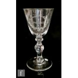 An 18th Century baluster Friendship goblet circa 1740, the large round funnel bowl engraved with '
