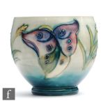 A Moorcroft footed sugar bowl decorated in the Arum Lily pattern, impressed mark, height 8cm,