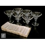 A set of six French champagne glasses, possibly St Louis, of shallow conical form with slice cut