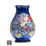 A small Moorcroft vase of baluster form decorated in the Clematis pattern, impressed mark, height