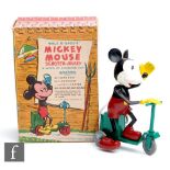 A Nurseryland Mickey Mouse Scooter Jockey, with plastic clockwork Mickey Mouse with wire tail on