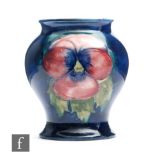 A small Moorcroft vase of inverted baluster form decorated in the Pansy pattern, impressed signature