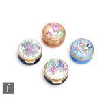 Four assorted Moorcroft Enamel miniature trinket boxes each decorated with flowers, printed mark,
