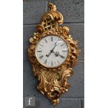 A 20th Century Cartel style gilt wall clock, eight day movement, circular white dial, height 60cm.