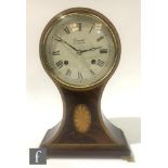 A contemporary mahogany veneered balloon mantel clock by Comitti of London, raised to polished brass