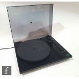 A Rega Planar 2 turntable record player, serial number 226469, on black plinth with dust cover.