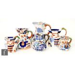 Four assorted 19th Century Masons Ironstone Hydra jugs with varying Chinoiserie decoration,