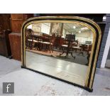 A Victorian gilt and ebonised over mantle mirror, double moulded edge, 84cm x 112cm.