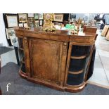 A Victorian inlaid and gilt metal mounted walnut credenza, the central panel door enclosed by a pair