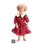 A Trendon Sasha doll with short red hair, wearing underwear and maroon dress.