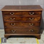 A George III mahogany straight front chest of two short and three long cock beaded drawers, brass