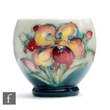 A Moorcroft footed sugar bowl decorated in the African Lily pattern, impressed mark, height 7cm.