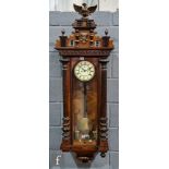 A late 19th Century walnut regulator wall clock with weight driven movement enclosed by a glazed