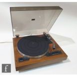 A Garrard DD75 record player direct drive transcription turntable with pickup arm, on veneered