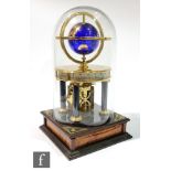A contemporary Millennium Clock, with gilded blue glass globe and moon within a hemispherical frame,