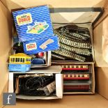 A collection of OO gauge Hornby Dublo coaches and rolling stock, all unboxed, with various