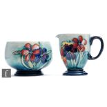 A Moorcroft milk jug and sugar bowl (or Strawberry set) decorated in the Spring Flowers pattern