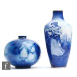 Two early 20th Century Royal Doulton Blue Children vases of varying form, the first of ovoid form