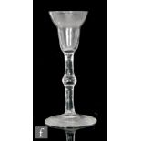 An 18th Century gin glass circa 1740, the pan top bowl above a plain stem with medial knop, raised