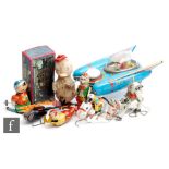 A collection of assorted tinplate and plastic toys, to include a Yanoman Space Scout S-17, a boxed