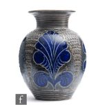 A 20th Century German vase of ovoid form with flared rim, decorated with blue fleur de lils style