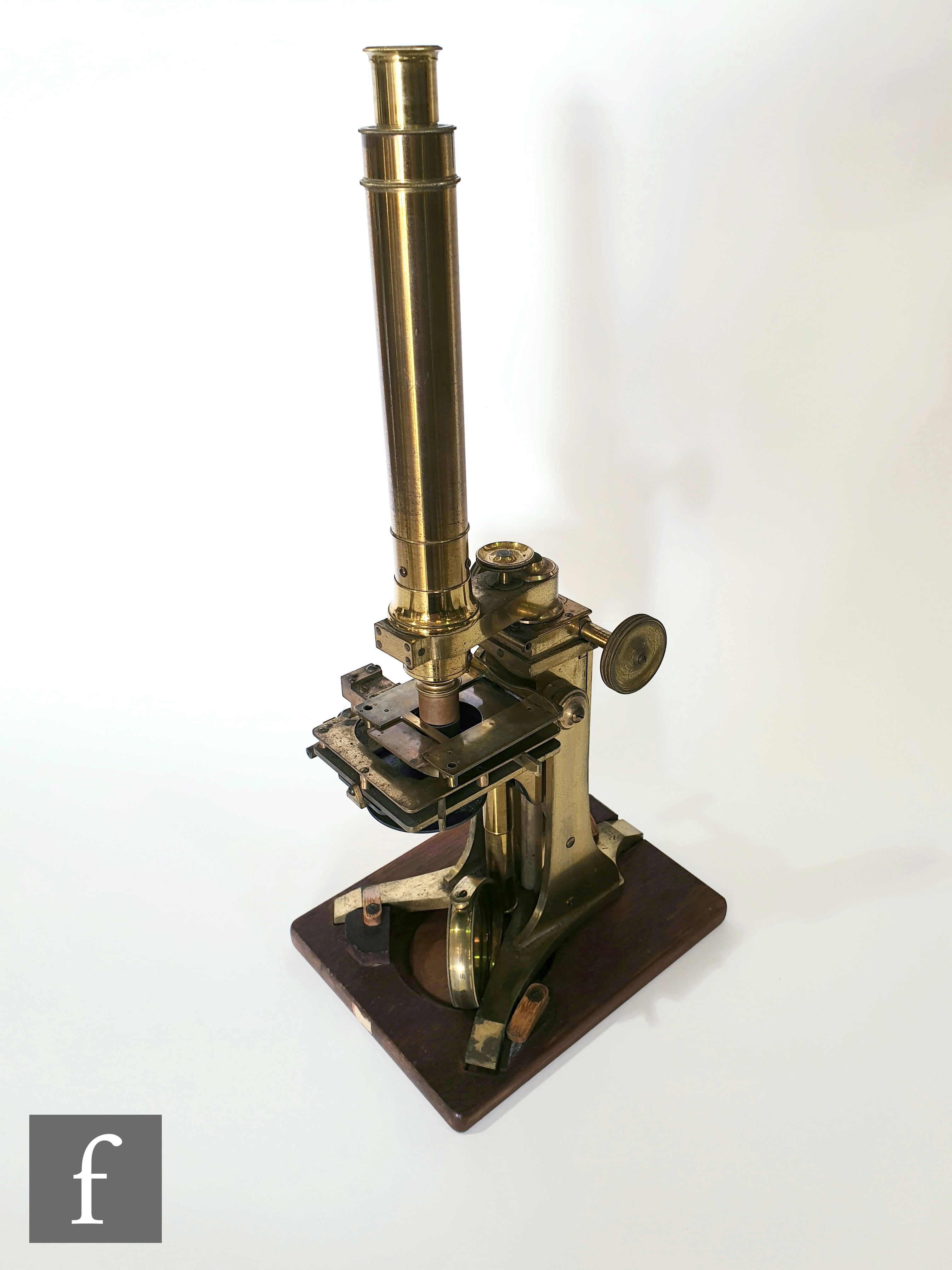 A mid 19th Century Bar-limb brass microscope by Andrew Ross, No 205, with tilt operation and