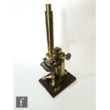 A mid 19th Century Bar-limb brass microscope by Andrew Ross, No 205, with tilt operation and