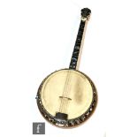 A Clifford Essex & Son 'Paragon' four string tenor banjo, with engraved pearl headstock and