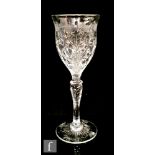 A later 19th Century Stevens & Williams rock crystal drinking glass, the ogee bowl decorated with