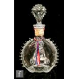 A Remy Martin decanter made by Baccarat, of compressed ovoid form with applied decorative fleur de