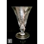 A 19th Century ale goblet circa 1870, the flared funnel bowl engraved with bees and flowers above an